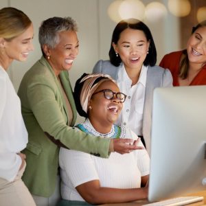 collaboration-laughter-business-manager-with-her-team-working-computer-office-night-teamwork-diversity-coaching-with-senior-woman-leader-training-her-staff-work_590464-151975